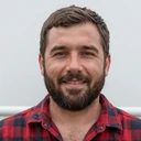 Portrait of Dale, a 44-year-old bearded truck driver who maintains a long-distance relationship